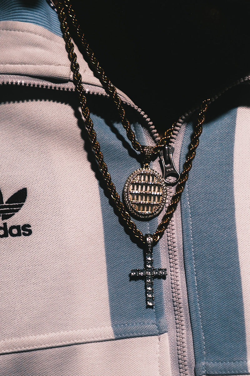 Adidas jacket close-up with gold chains